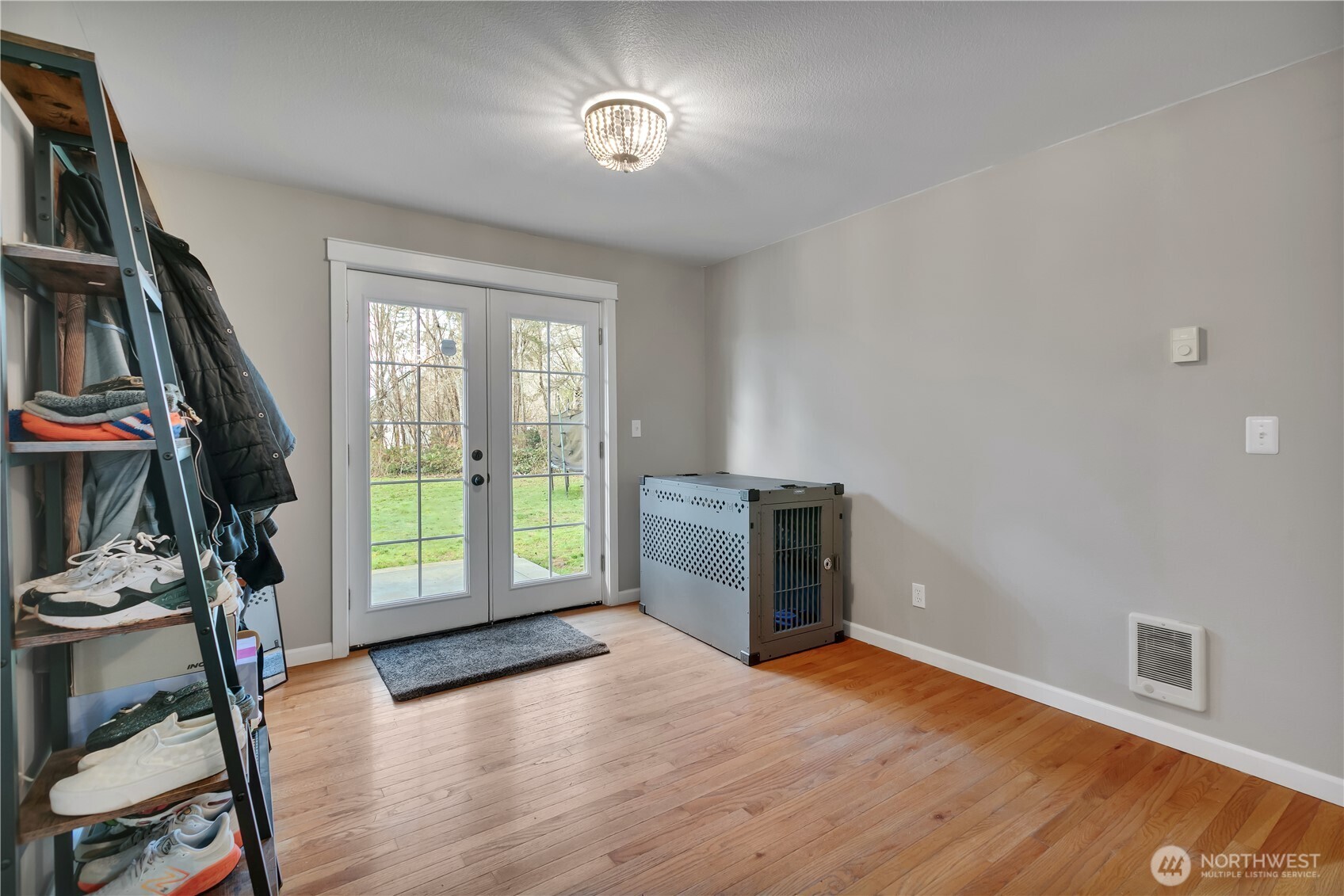 770 East Cedar Street Belfair, WA 98528 - Photo 11 of 31 a view of an empty room with a window and wooden floor