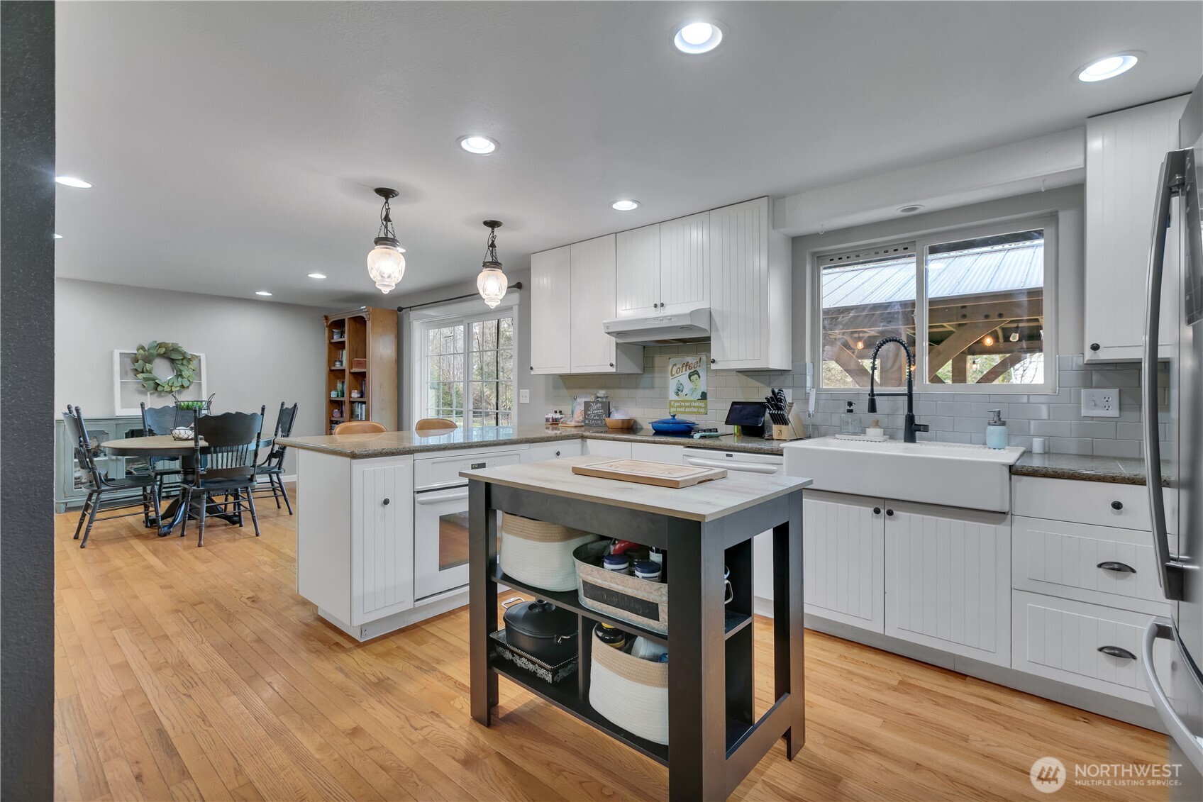 770 East Cedar Street Belfair, WA 98528 - Photo 13 of 31 a kitchen with a sink stove and cabinets