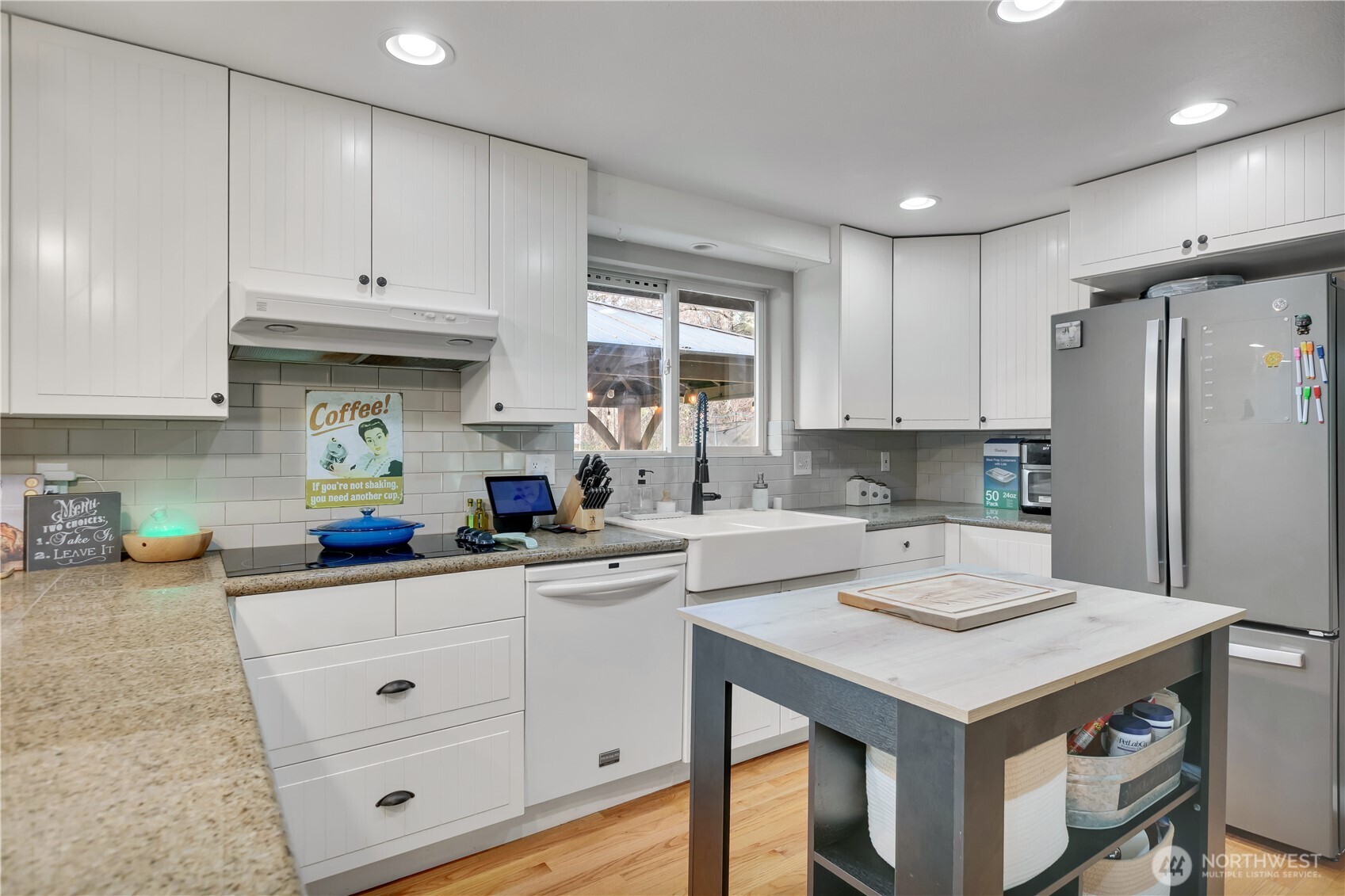 770 East Cedar Street Belfair, WA 98528 - Photo 15 of 31 a kitchen with a sink dishwasher a stove and white cabinets with wooden floor