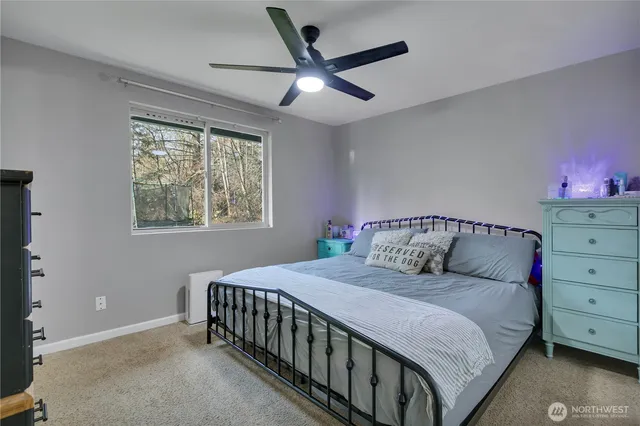 a bedroom with a large bed and a window