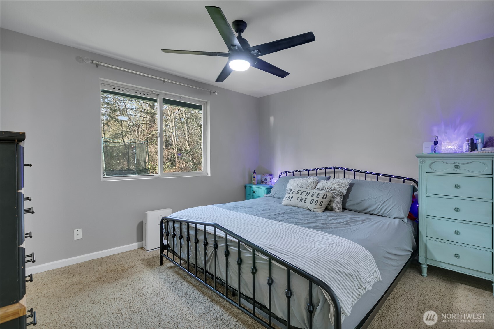 770 East Cedar Street Belfair, WA 98528 - Photo 21 of 31 a bedroom with a large bed and a window