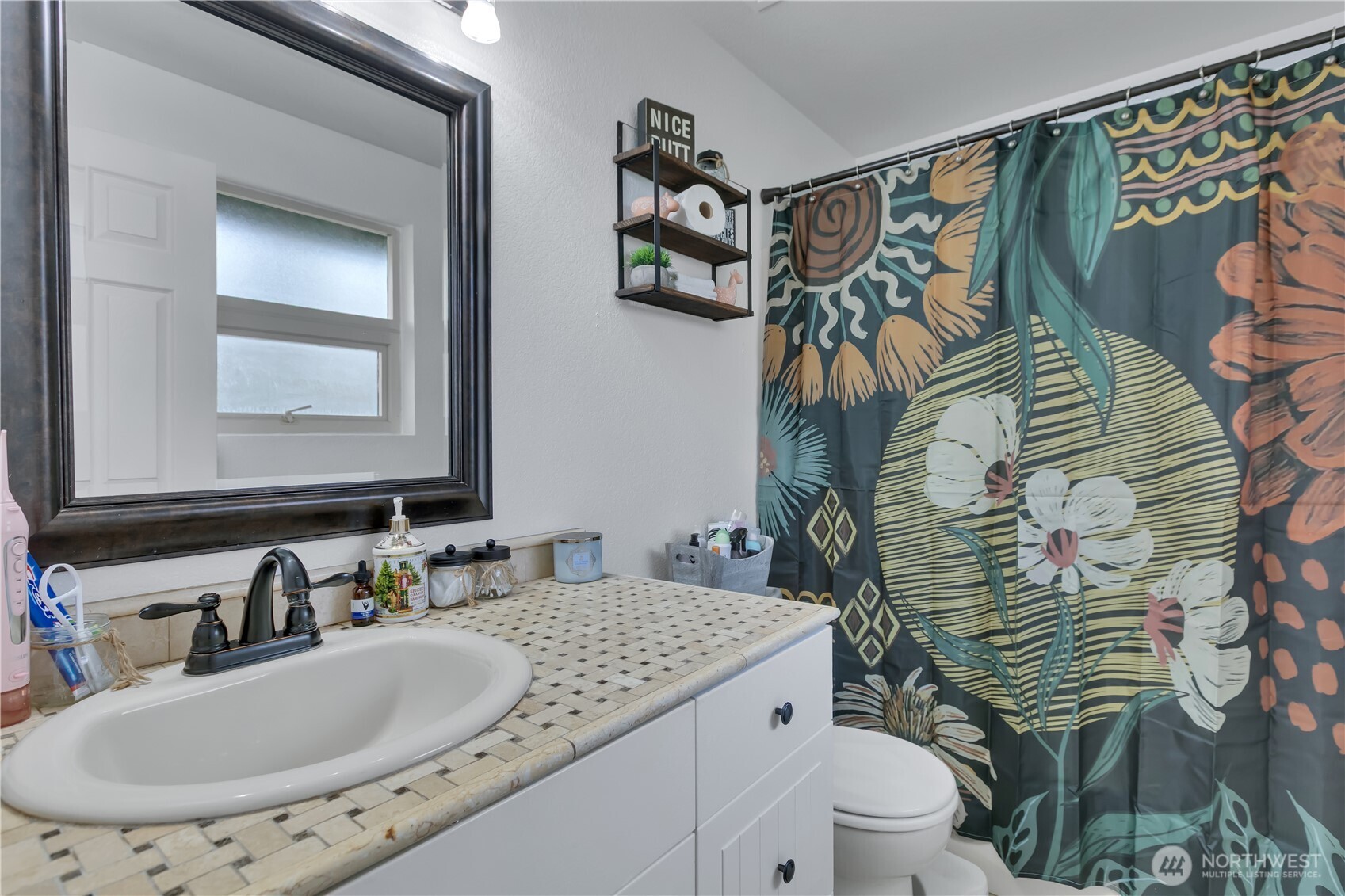 770 East Cedar Street Belfair, WA 98528 - Photo 22 of 31 a bathroom with a sink and mirror with toilet