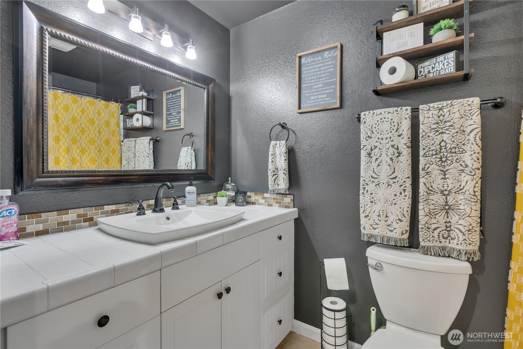 770 East Cedar Street Belfair, WA 98528 - Photo 24 of 31 a bathroom with a toilet sink and mirror