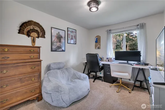 a workspace with furniture and a window