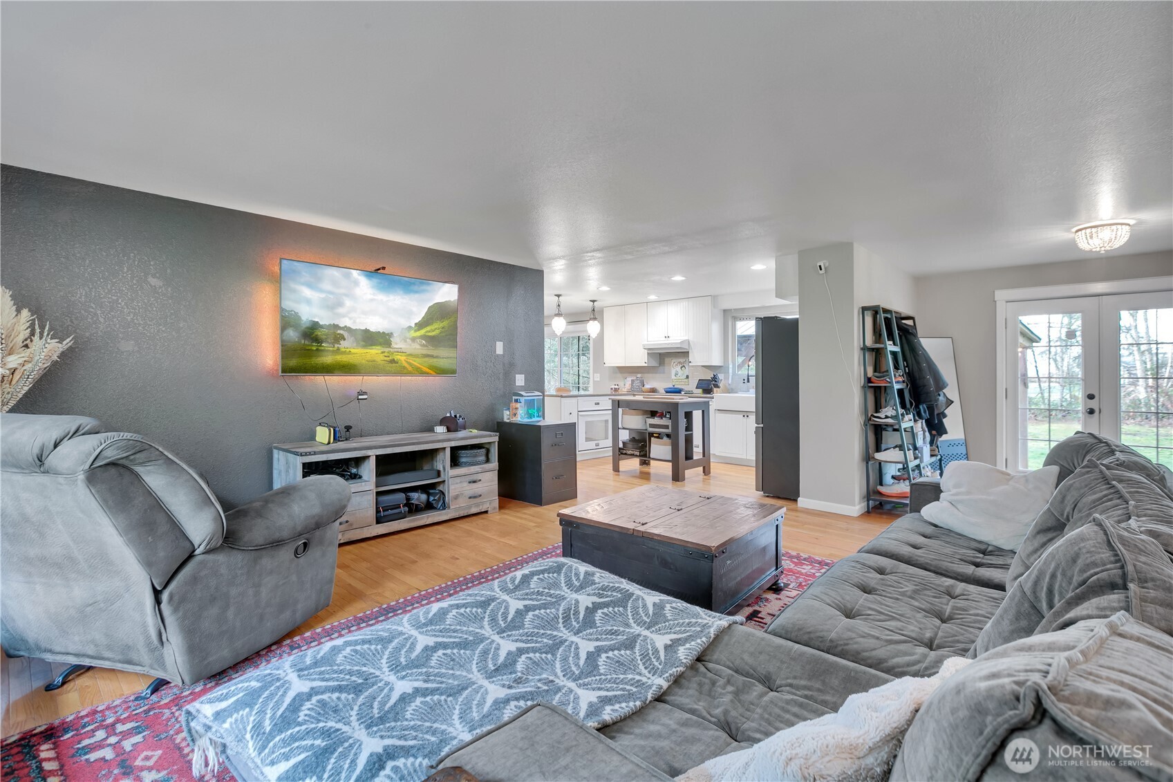 770 East Cedar Street Belfair, WA 98528 - Photo 5 of 31 a living room with furniture kitchen view and a large window