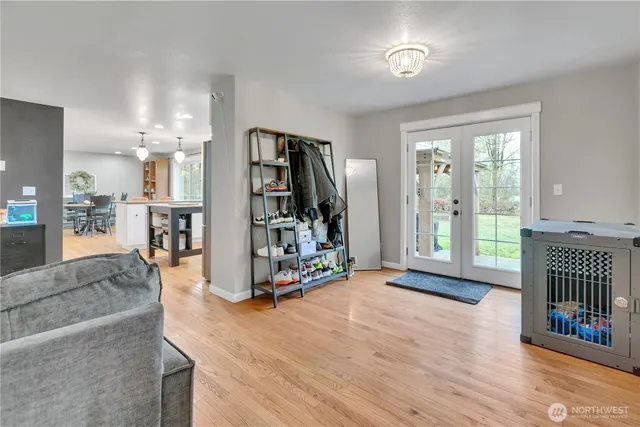 a view of a livingroom with furniture and a floor to ceiling window