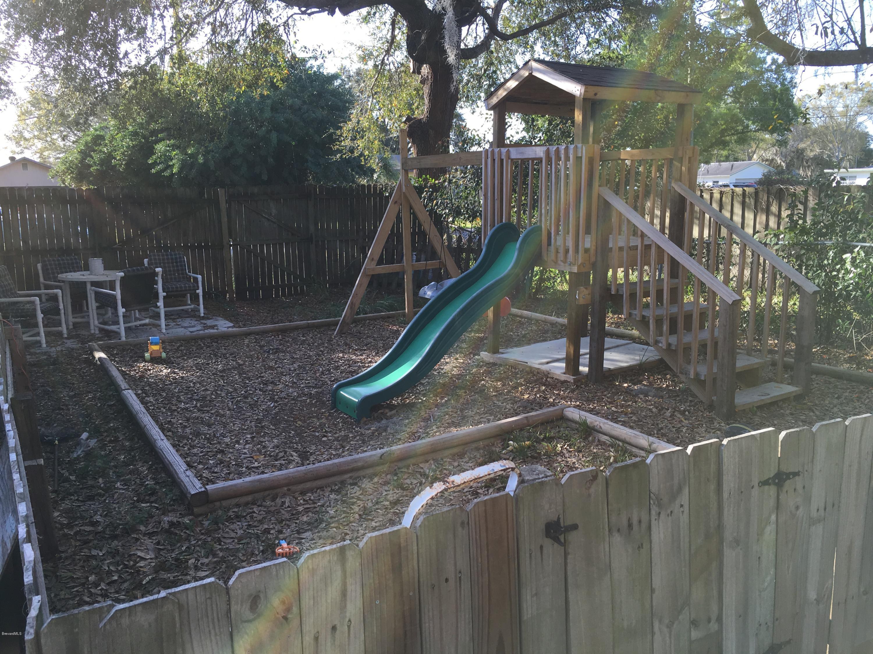 1114 Pinedale Road Rockledge, FL 32955 - Photo 22 of 24 Playground in Back Yard