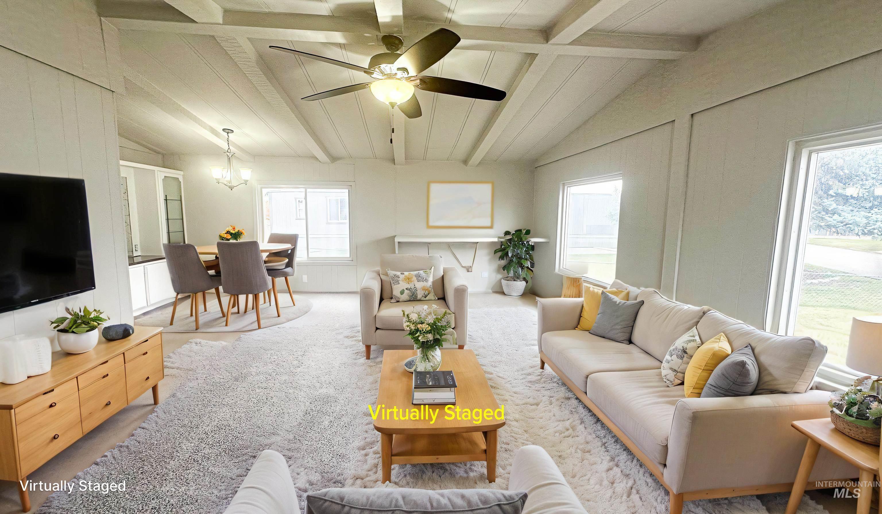 1200 Artesian Road Eagle, ID 83616 - Photo 6 of 18 Living area featuring vaulted ceiling with beams, a ceiling fan, plenty of natural light, and carpet