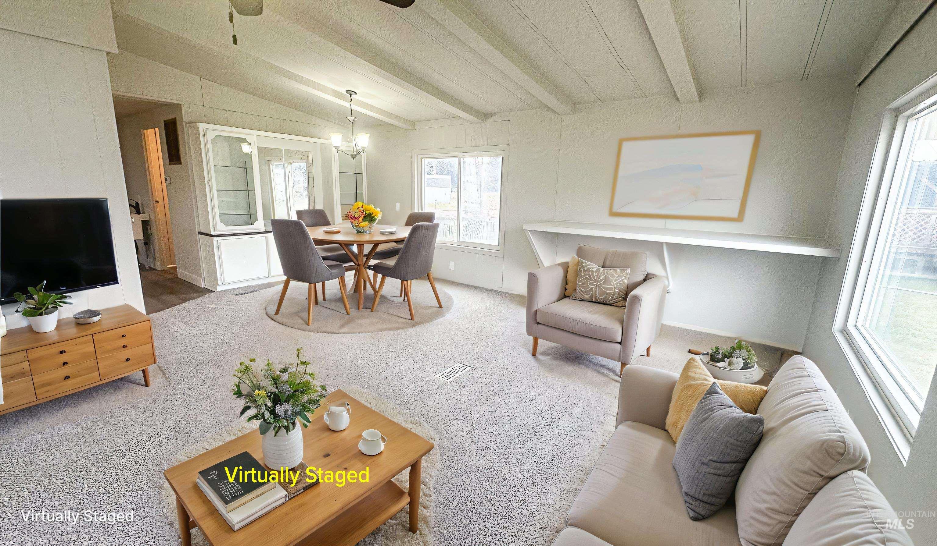 1200 Artesian Road Eagle, ID 83616 - Photo 7 of 18 Carpeted living room with lofted ceiling with beams and ceiling fan