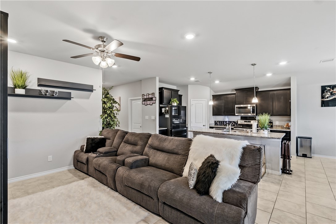 2009 Chief Street Bryan, TX 77807 - Photo 6 of 27 a living room with furniture kitchen view and a chandelier