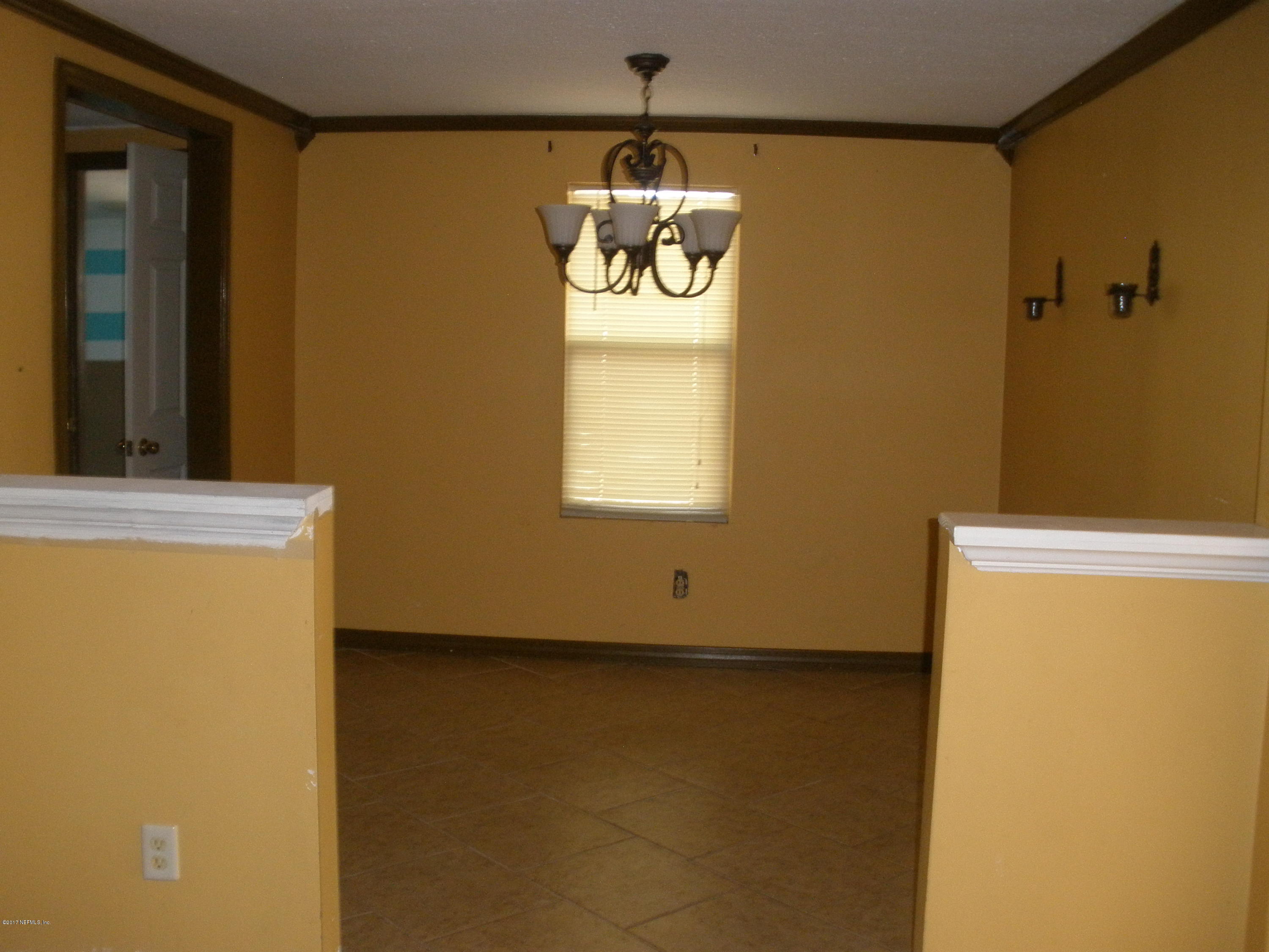220 Alvis Road Jacksonville, FL 32220 - Photo 8 of 18 a view of an empty room with a window