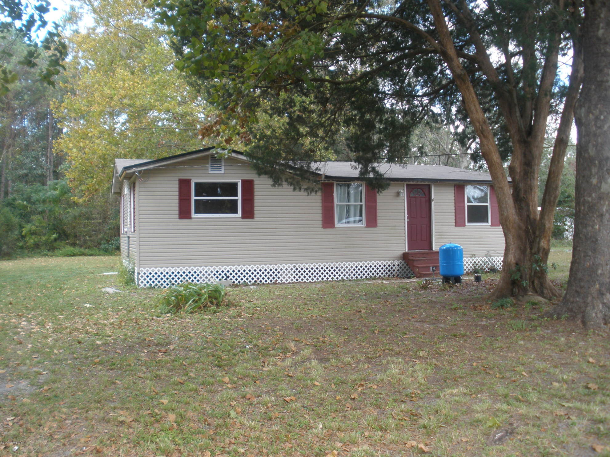 220 Alvis Road Jacksonville, FL 32220 - Photo 9 of 18 a house view with a backyard space