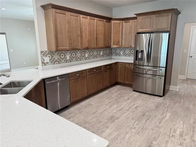 a bathroom with a sink a mirror and shower