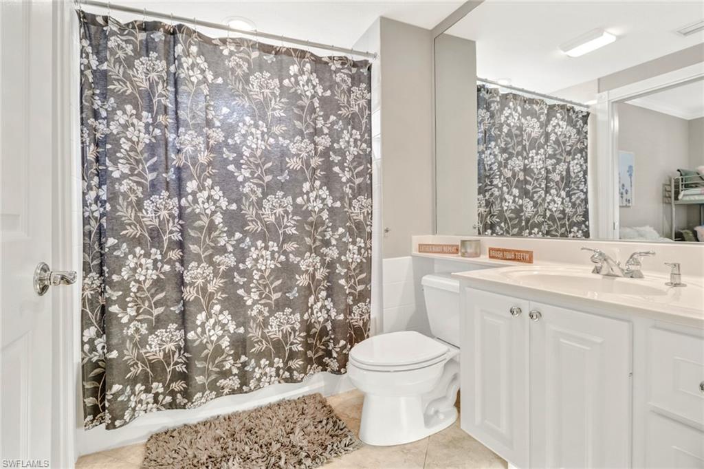 8028 Josefa Way Naples, FL 34114 - Photo 12 of 27 a bathroom with a sink toilet and shower
