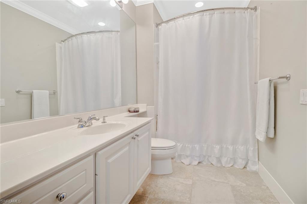 8028 Josefa Way Naples, FL 34114 - Photo 19 of 27 a bathroom with a sink a toilet and shower