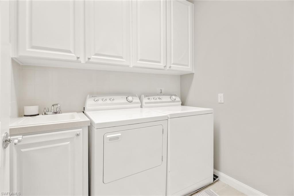 8028 Josefa Way Naples, FL 34114 - Photo 20 of 27 a utility room with dryer and washer
