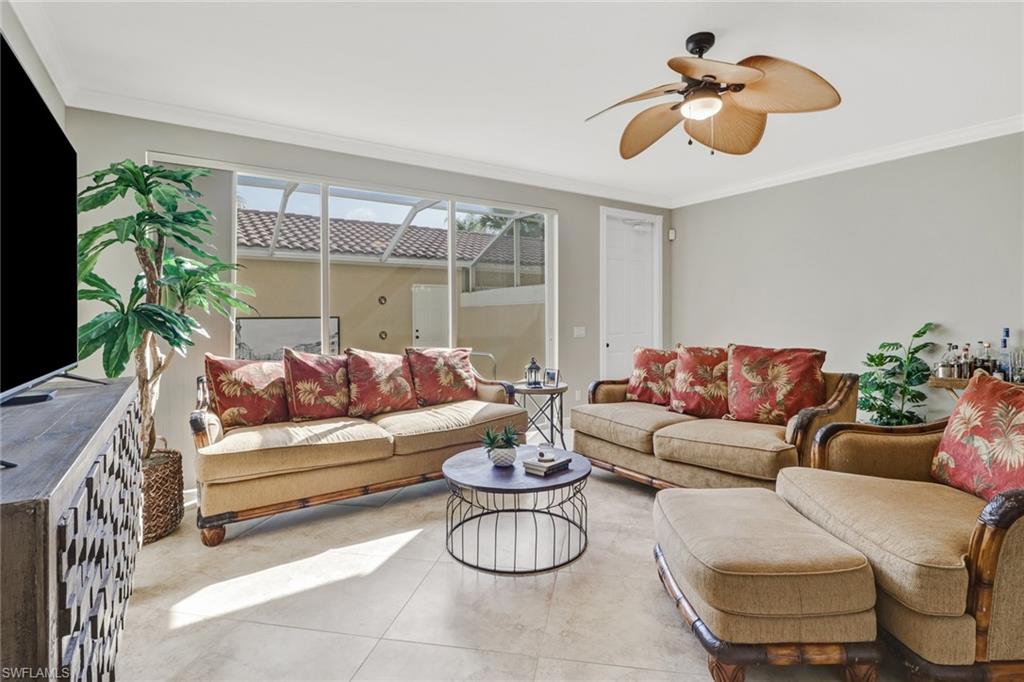 8028 Josefa Way Naples, FL 34114 - Photo 2 of 27 a living room with furniture and a large window