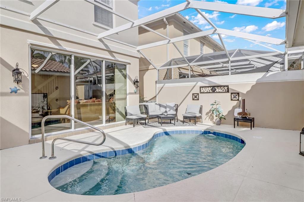 8028 Josefa Way Naples, FL 34114 - Photo 22 of 27 a view of a swimming pool with seating