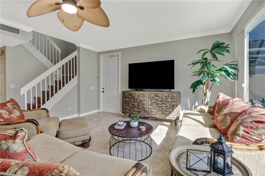 8028 Josefa Way Naples, FL 34114 - Photo 4 of 27 a living room with furniture and a flat screen tv