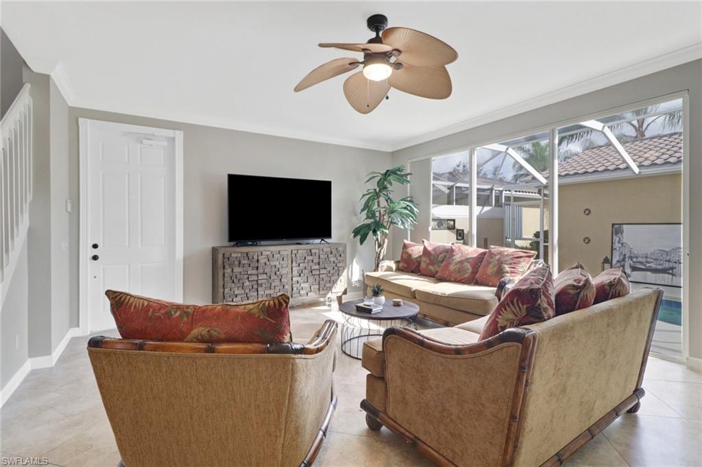 8028 Josefa Way Naples, FL 34114 - Photo 5 of 27 a living room with furniture and a flat screen tv