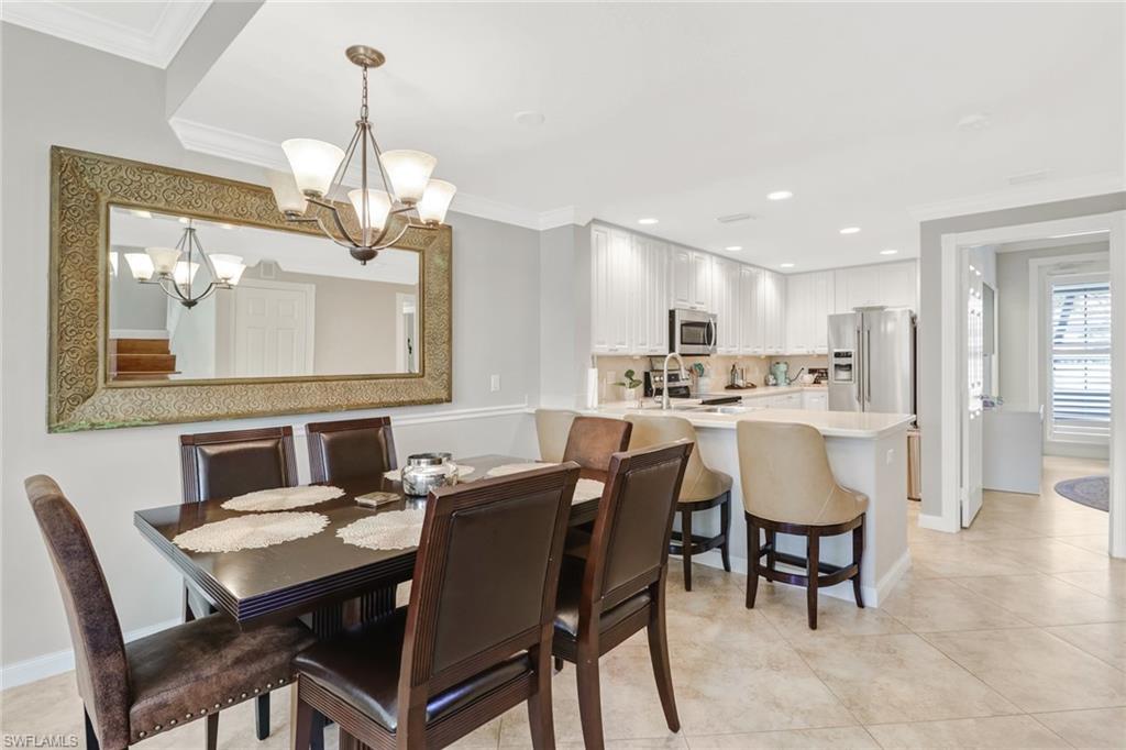 8028 Josefa Way Naples, FL 34114 - Photo 6 of 27 a view of a dining room with furniture