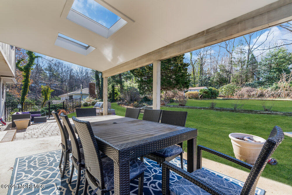 31 Lower Prospect Road Atlantic Highlands, NJ 07716 - Photo 54 of 67 a view of a patio with a table chairs and a backyard