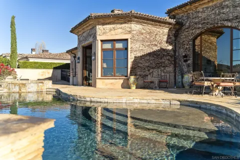 a view of a swimming pool with an ocean view