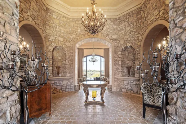 a view of a entryway door with a chandelier