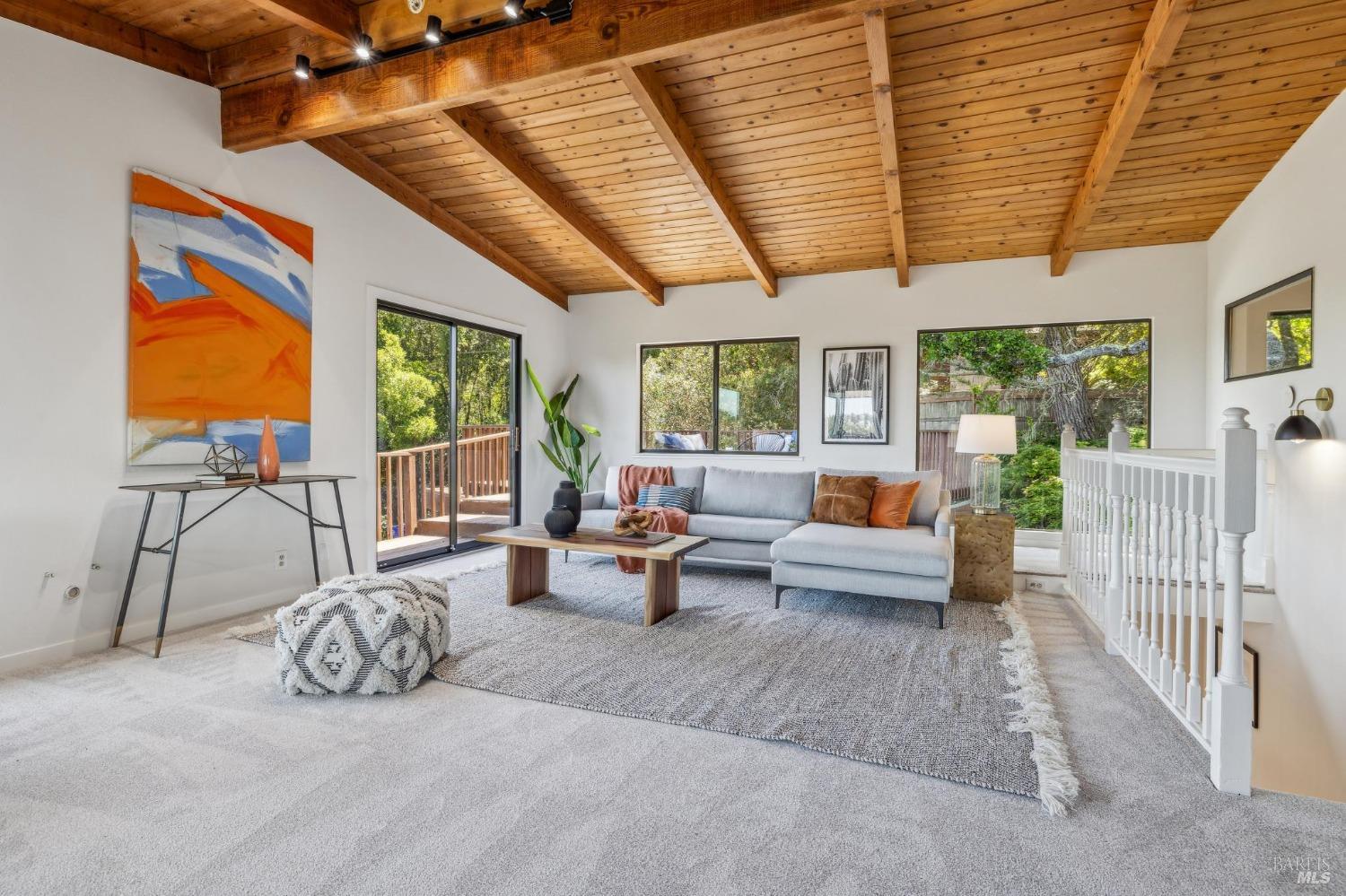 480 Live Oak Drive Mill Valley, CA 94941 - Photo 12 of 71 a living room with furniture a flat screen tv and floor to ceiling windows