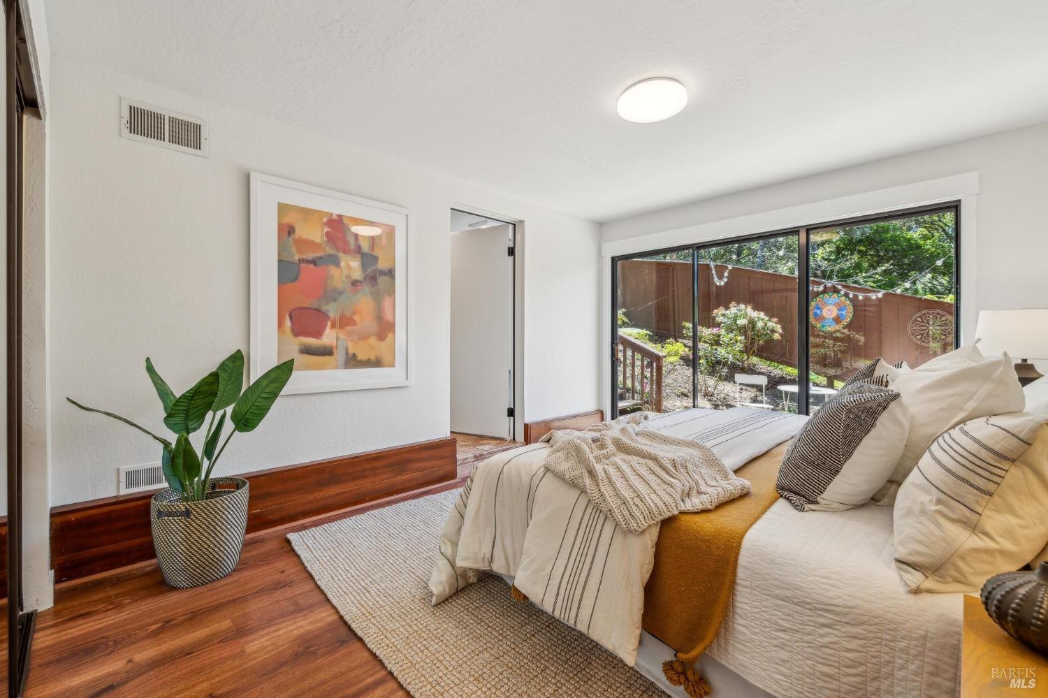480 Live Oak Drive Mill Valley, CA 94941 - Photo 55 of 71 a bedroom with a bed and a potted plant