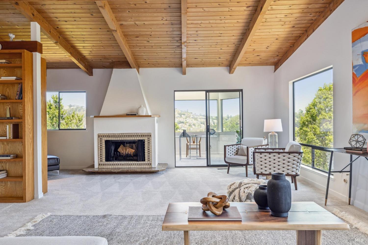 480 Live Oak Drive Mill Valley, CA 94941 - Photo 7 of 71 a living room with furniture a fireplace and a table