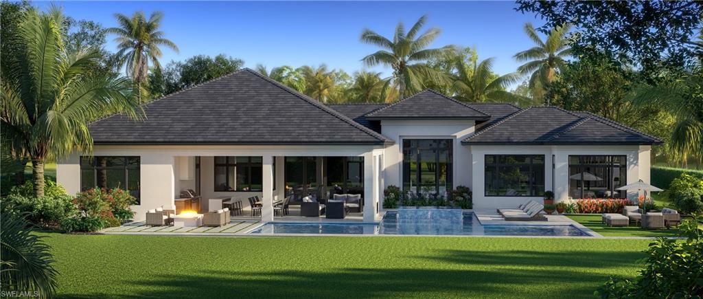 3062 Ravenna Avenue Naples, FL 34102 - Photo 2 of 7 a view of a house with a patio yard and swimming pool