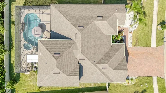 an aerial view of a house with a garden