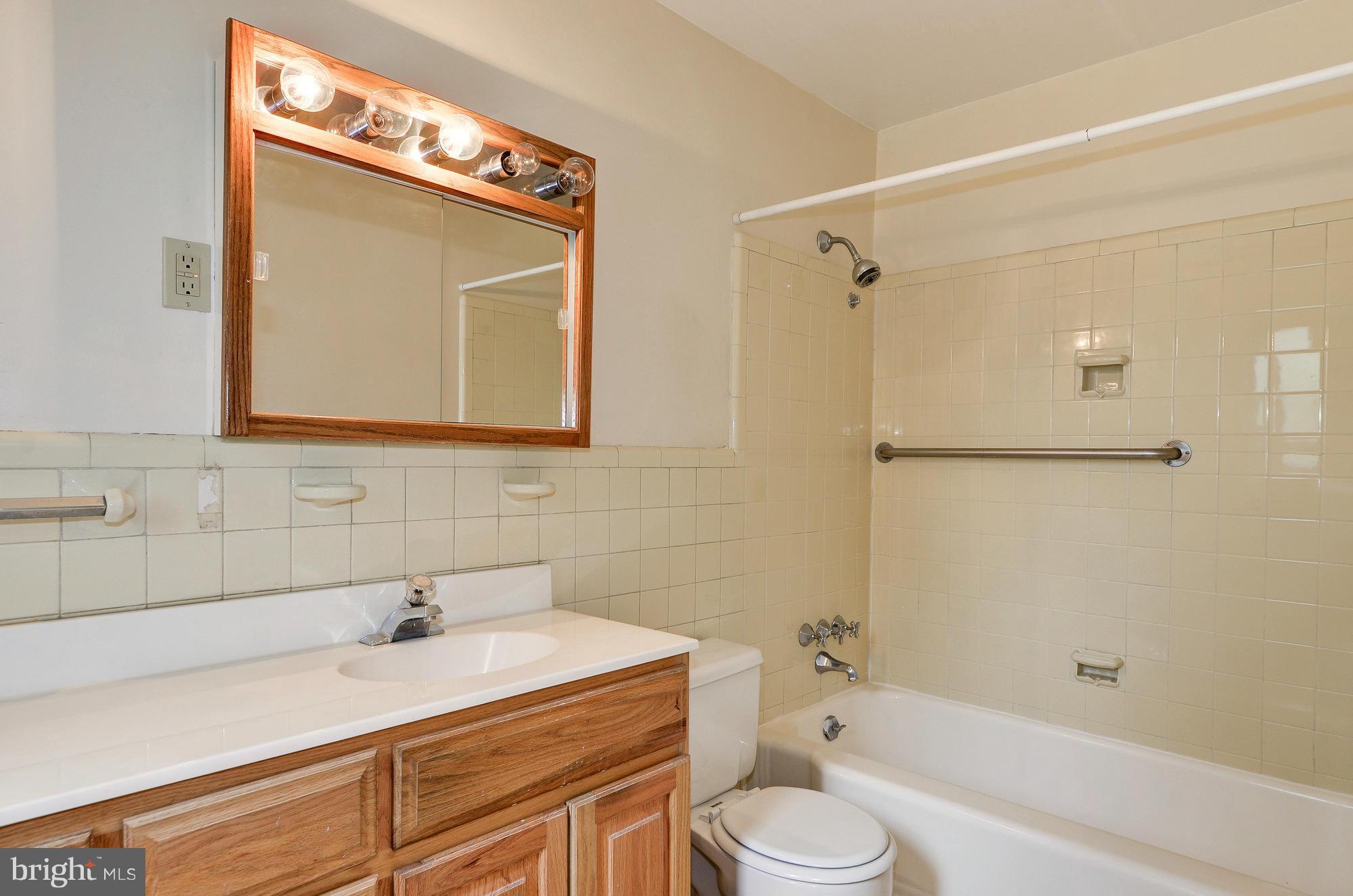 3238 Park View Road Chevy Chase, MD 20815 - Photo 19 of 28 a bathroom with a sink and a mirror