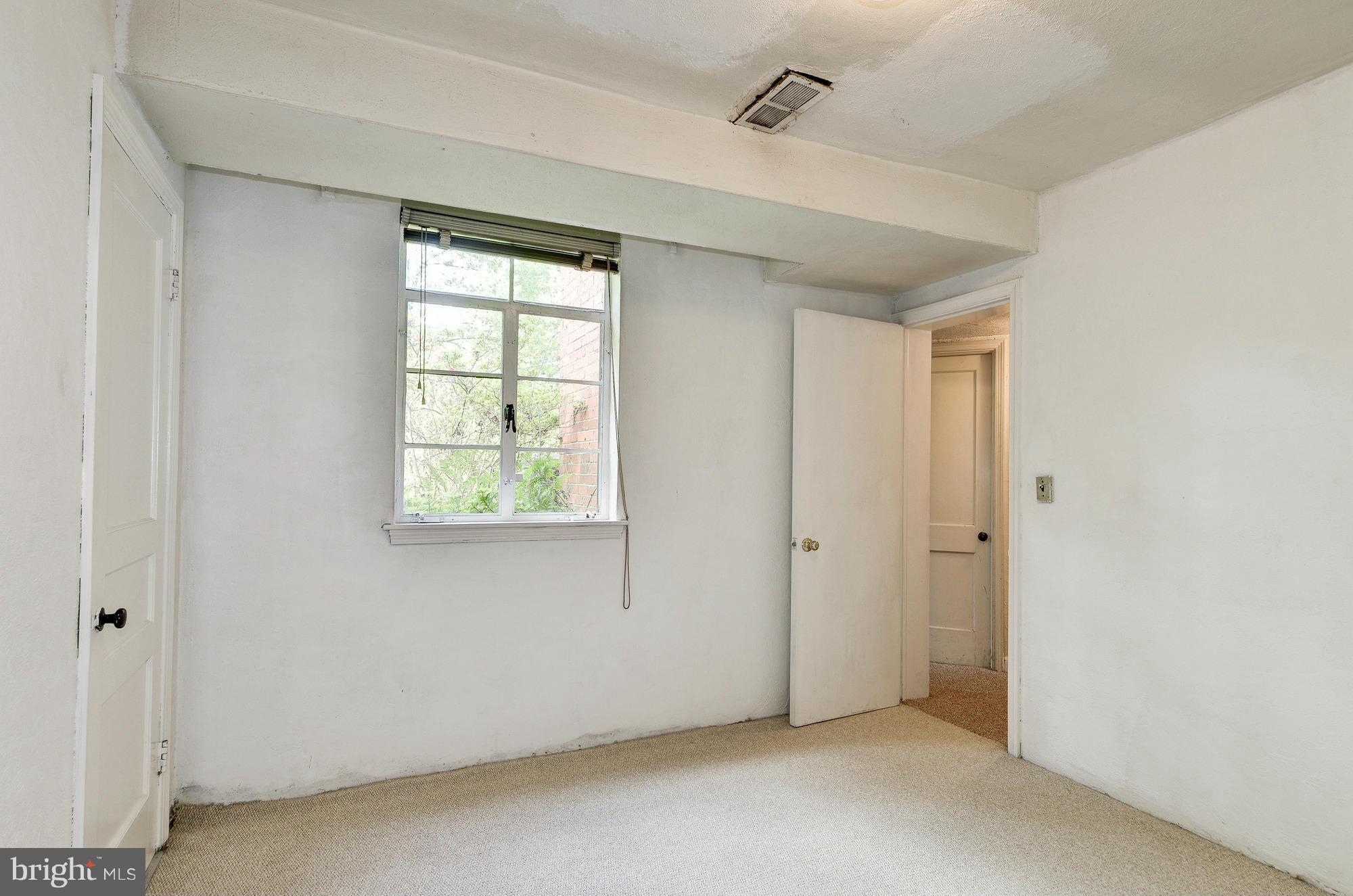 3238 Park View Road Chevy Chase, MD 20815 - Photo 22 of 28 a view of an empty room with a window
