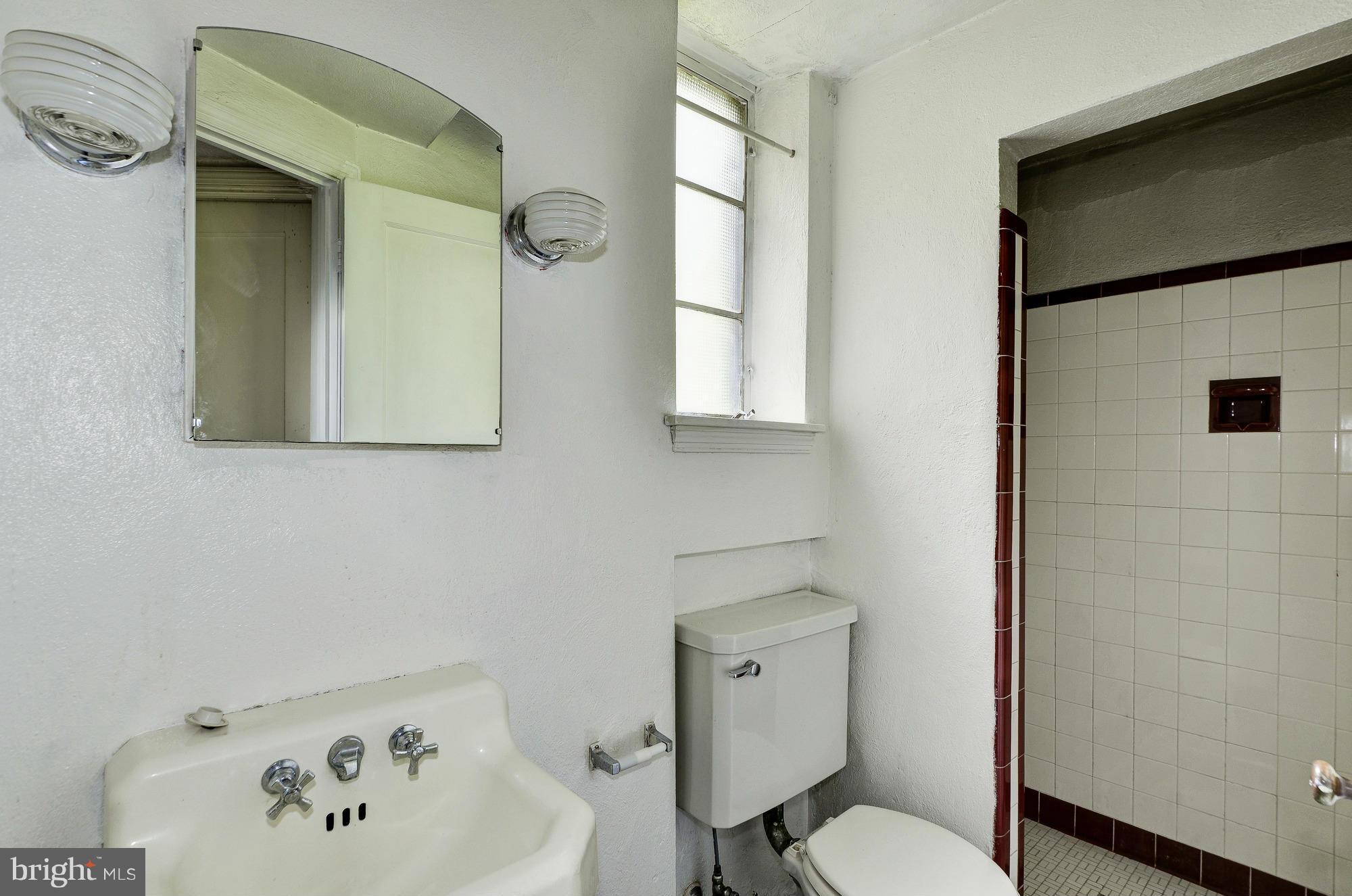 3238 Park View Road Chevy Chase, MD 20815 - Photo 23 of 28 a bathroom with a toilet sink and mirror