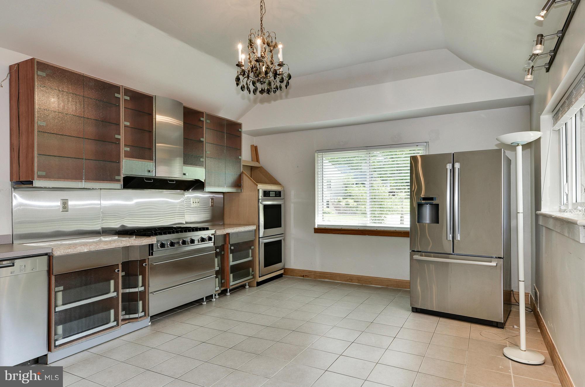 3238 Park View Road Chevy Chase, MD 20815 - Photo 7 of 28 a kitchen with stainless steel appliances granite countertop a stove and a refrigerator