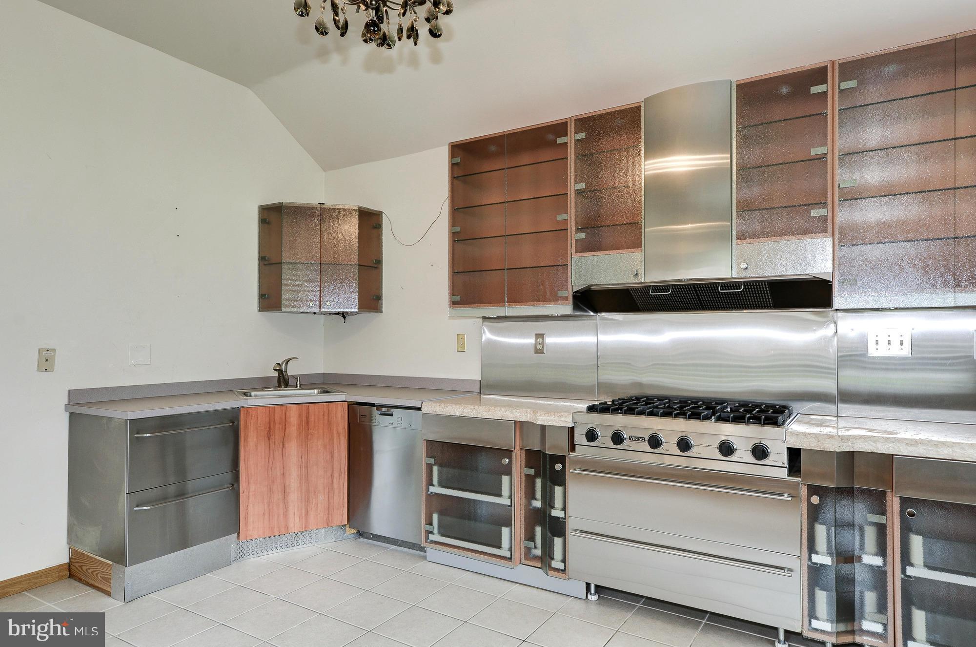 3238 Park View Road Chevy Chase, MD 20815 - Photo 8 of 28 a kitchen with stainless steel appliances a stove and a microwave