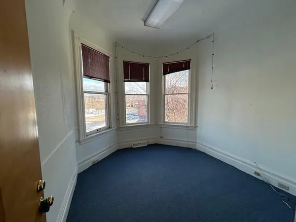 an empty room with windows