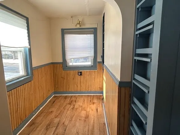 a view of an entryway with wooden floor