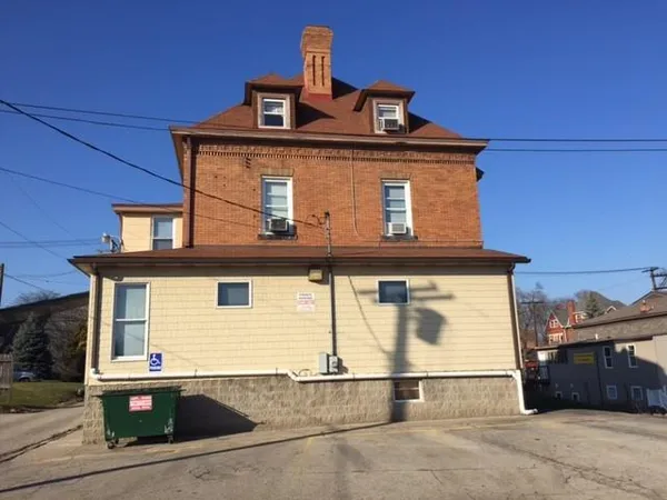 a front view of a house with a garage