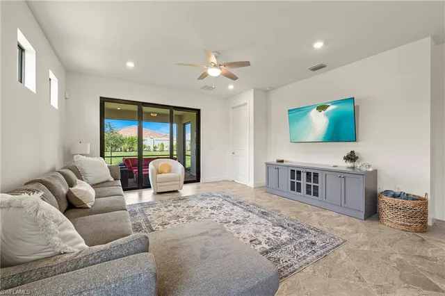 a living room with furniture kitchen view and a dining table