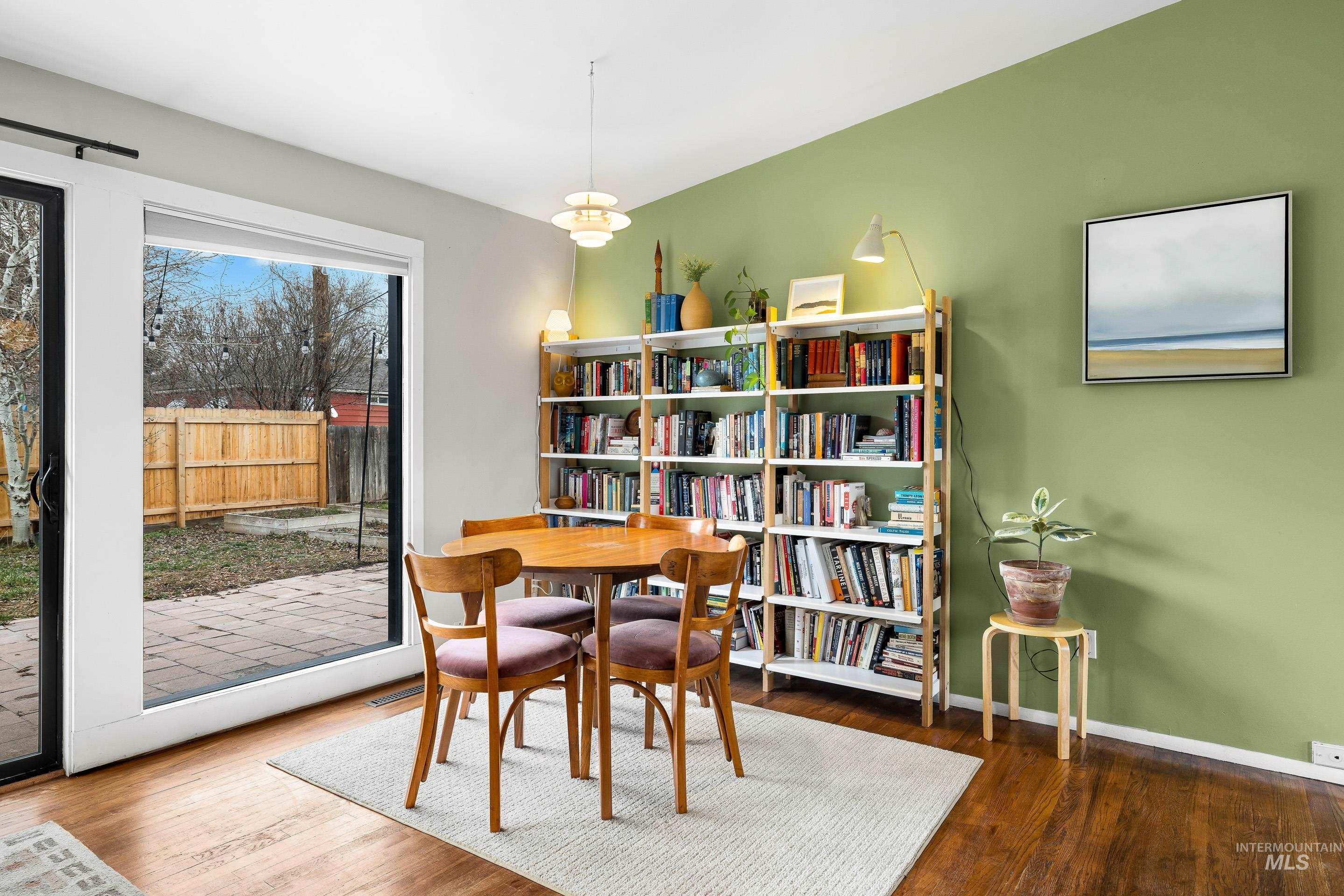 2824 West Kathryn Street Boise, ID 83705 - Photo 12 of 40 Dining room featuring dark wood-style flooring and baseboards