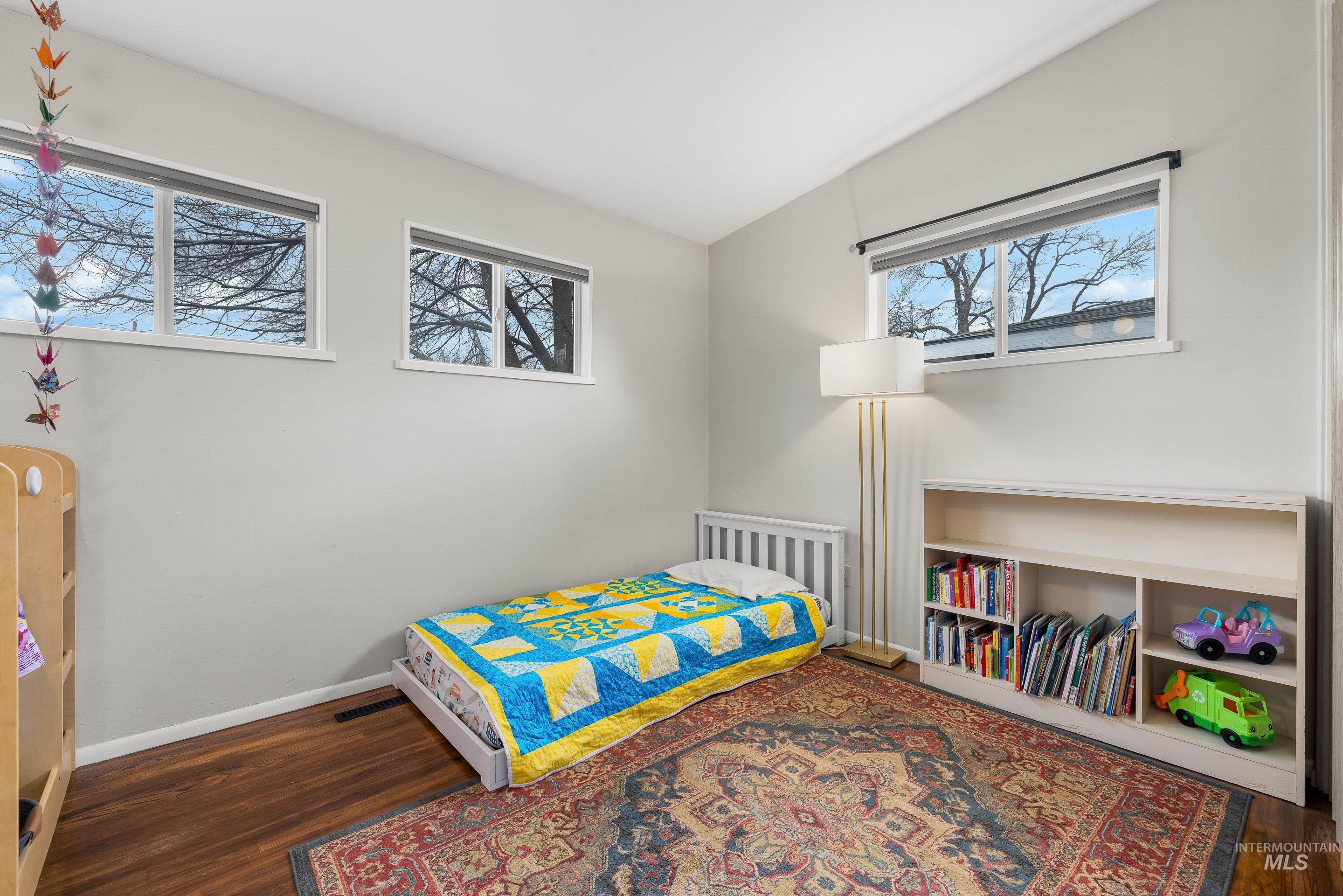 2824 West Kathryn Street Boise, ID 83705 - Photo 31 of 40 Bedroom featuring lofted ceiling and dark wood-type flooring