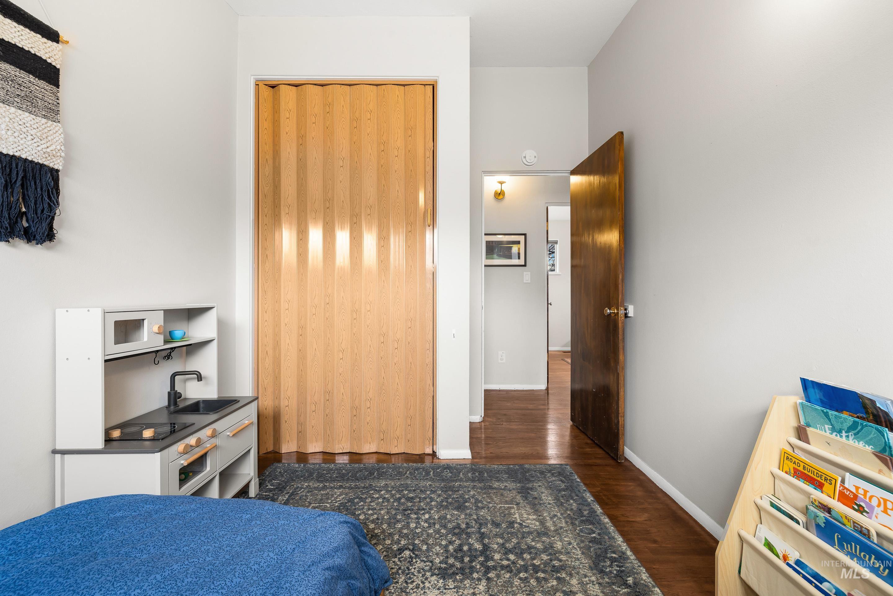 2824 West Kathryn Street Boise, ID 83705 - Photo 34 of 40 Bedroom with dark wood-type flooring and a closet