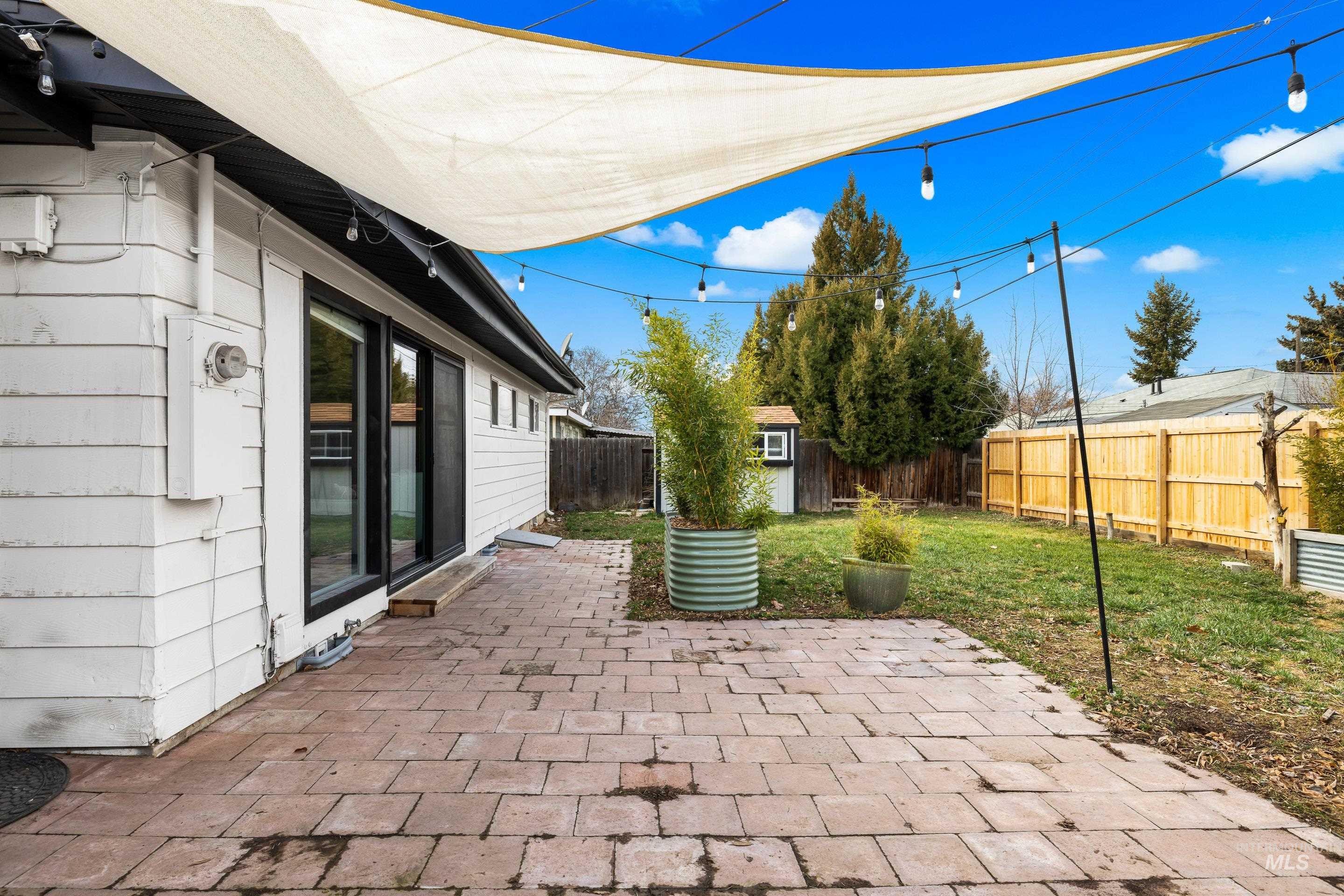 2824 West Kathryn Street Boise, ID 83705 - Photo 36 of 40 Fenced backyard featuring a patio area and a storage unit