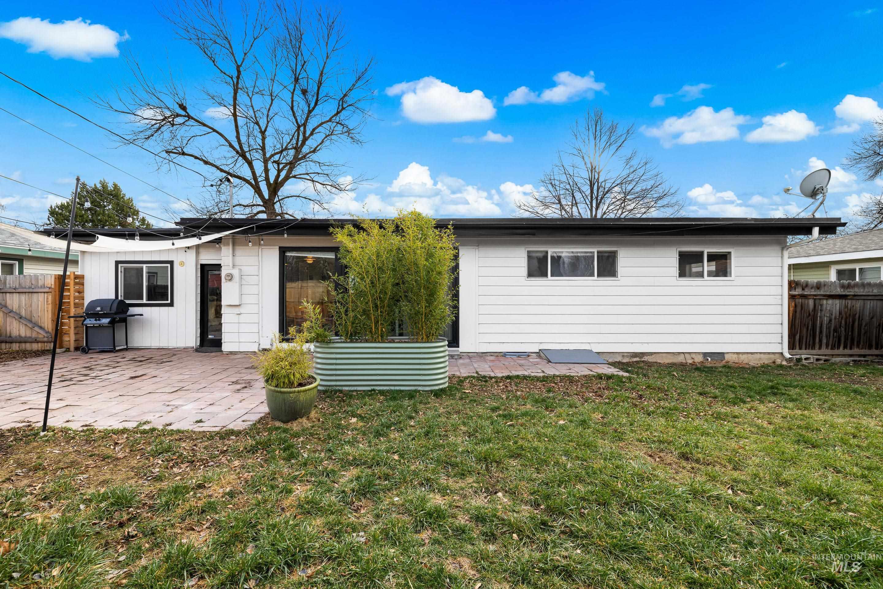 2824 West Kathryn Street Boise, ID 83705 - Photo 38 of 40 Rear view of house with a fenced backyard and a patio area