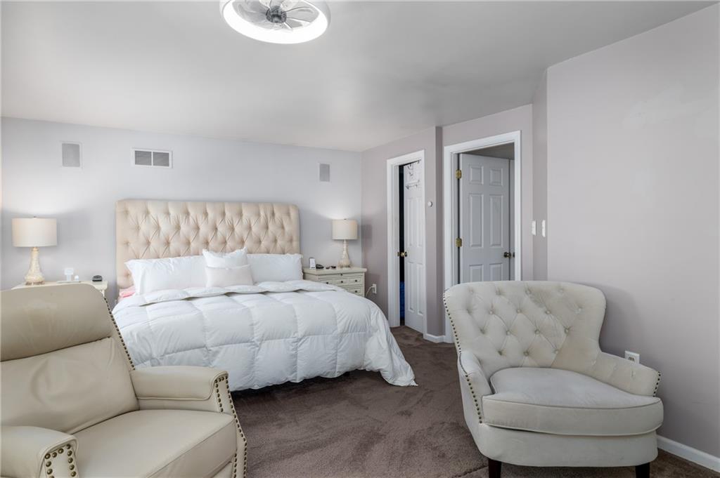 45 Spring Valley Drive Washington, PA 15301 - Photo 15 of 26 a bedroom with a bed and a couch