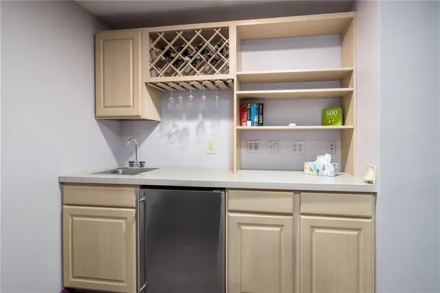 a kitchen with a sink and cabinets