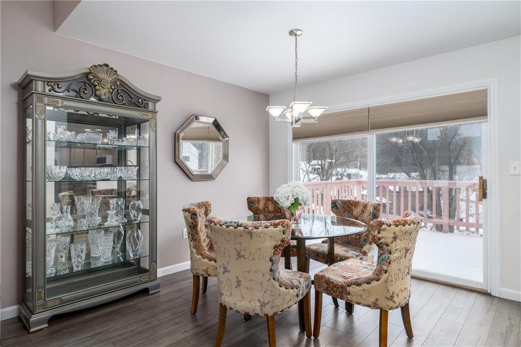 45 Spring Valley Drive Washington, PA 15301 - Photo 7 of 26 a dining room with furniture a chandelier and wooden floor
